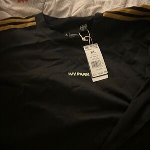 IVY PARK Black Shirt with Gold Stripes